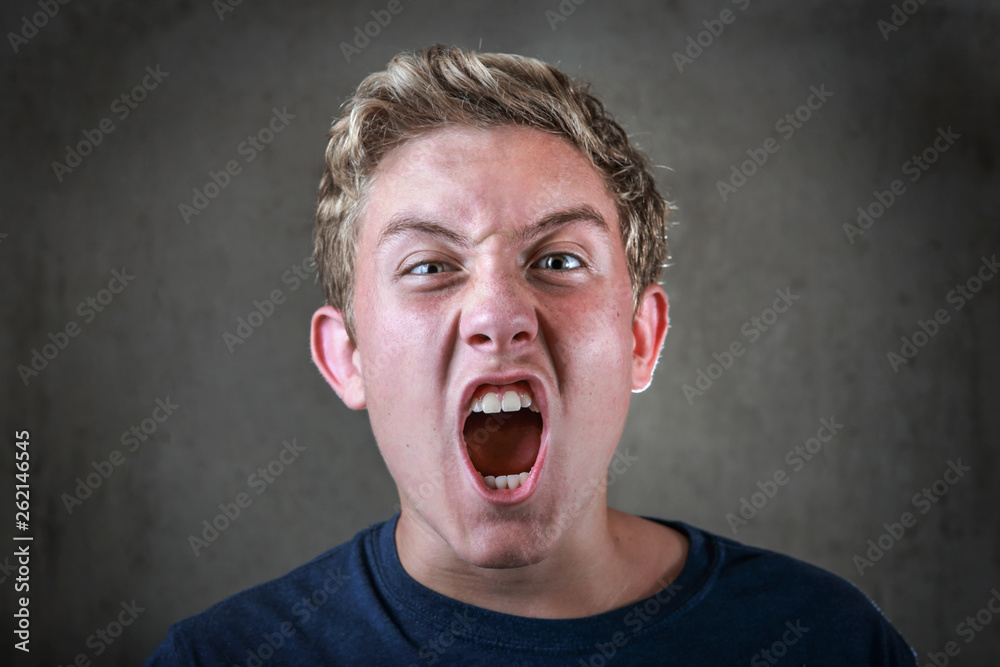 Angry young teenager yelling Angry young teenager yelling