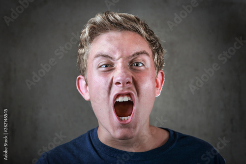 Angry young teenager yelling