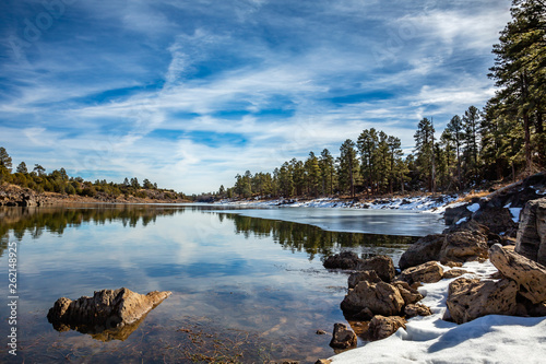Fototapeta Naklejka Na Ścianę i Meble -  A quiet wintry scene along the shore of Fools Hollow Lake. Near Show Low in Arizona's White Mountains.