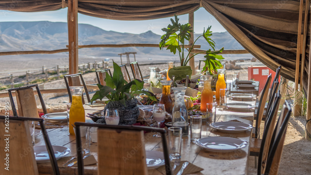 Bedouin hospitality dinner table in a tent- Israel desert