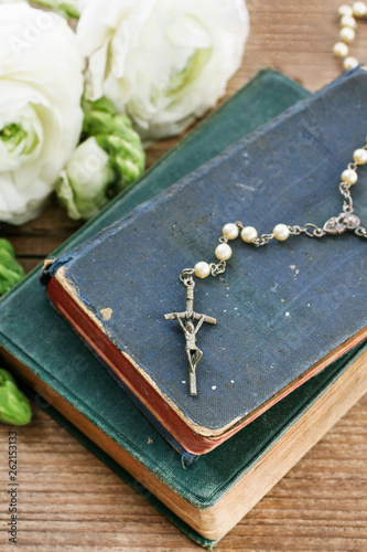 Holy Bible and white rosary