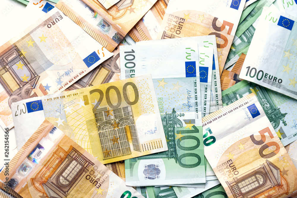 Euro banknotes from above. Scattered banknotes on the table. Euro banknotes from above. Scattered banknotes on the table.