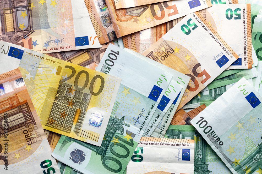 Euro banknotes from above. Scattered banknotes on the table. Euro banknotes from above. Scattered banknotes on the table.