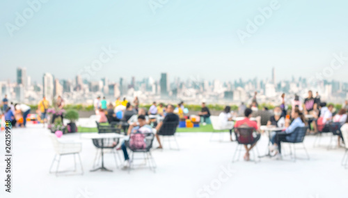 Fototapeta Naklejka Na Ścianę i Meble -  Blur people in city park with landscape of town