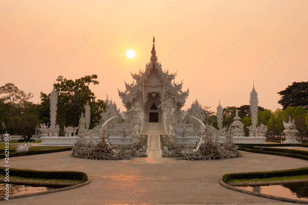 Wat Rong Khun (White temple) during sunset in Chiangrai, Thailand.