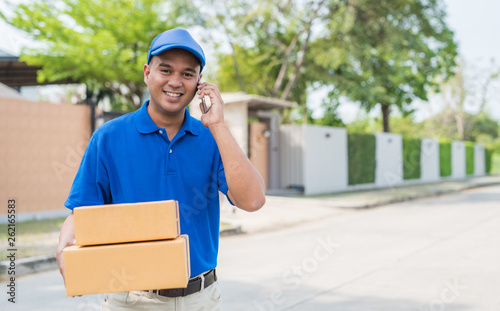 Blue Delivery man and parcel box package.