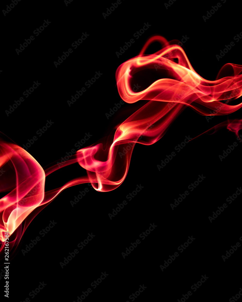 Obraz premium Red smoke on black background