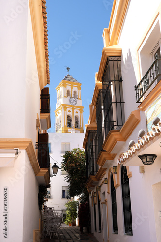 Marbella old town church bell tower whitewashed village street