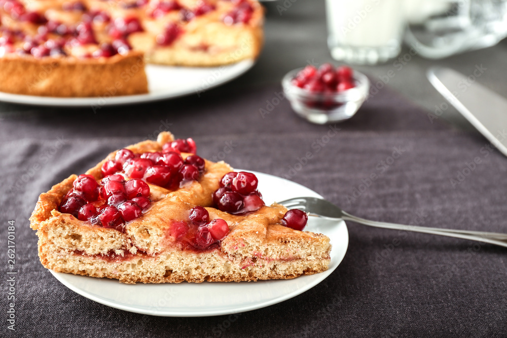 Plate with piece of tasty cranberry pie on table Plate with piece of tasty cranberry pie on table