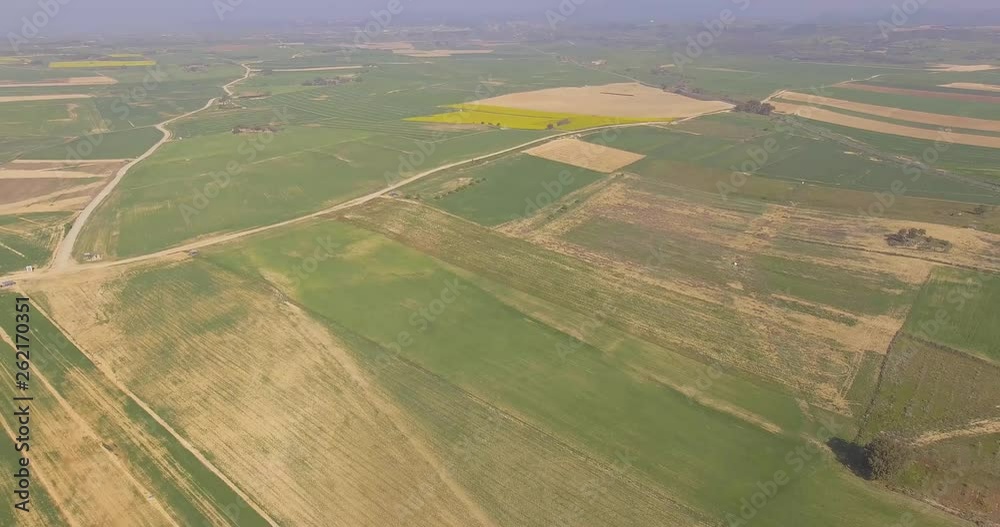 Flying back at high speed with drone over the planted fields. Flying back at high speed with drone over the planted fields.