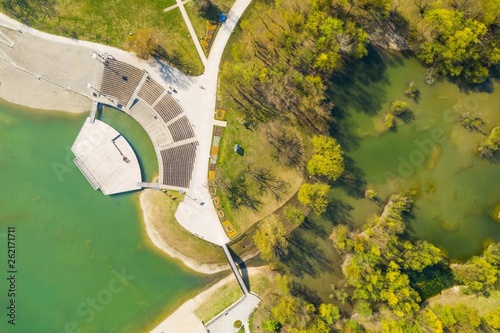 Zagreb city, Croatia, Bundek lake and park with summer stage from drone, overhead view, green recreaction area