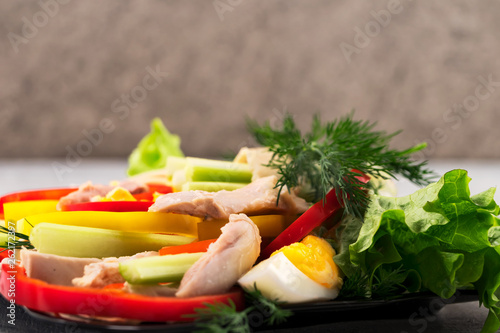 Slices of boiled meat, pepper slices, celery, lettuce with dill - the ingredients for making burrito. Traditional Mexican food. Place to copy.