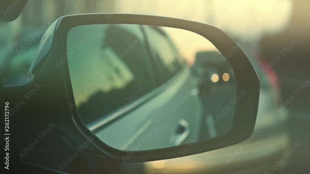 car mirror on the background of the blurred background of the road. car mirror on the background of the blurred background of the road.