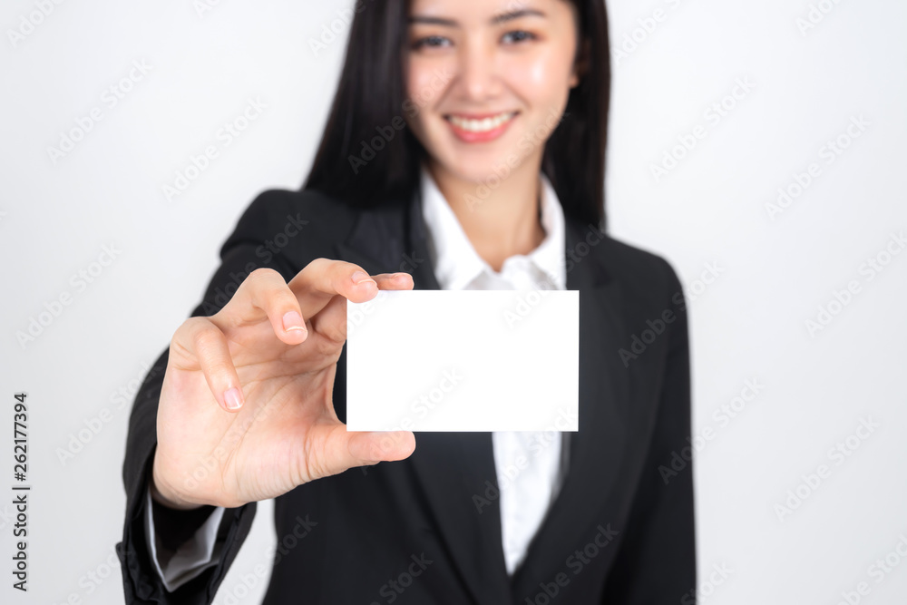 business woman holding and showing empty business card or name card - business concept business woman holding and showing empty business card or name card - business concept