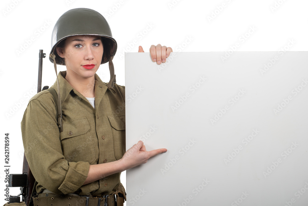 young woman dressed in American ww2 military uniform showing empty blank signboard young woman dressed in American ww2 military uniform showing empty blank signboard