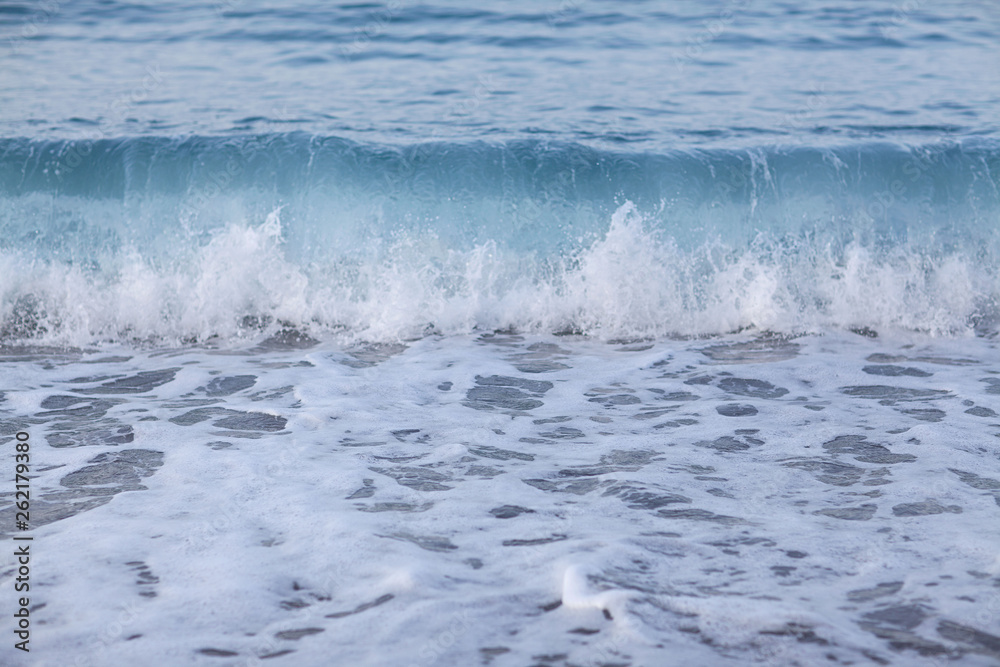 Sea waves and beach view at sunset, pastel colors. Concept of calm or relaxation. Summer background Sea waves and beach view at sunset, pastel colors. Concept of calm or relaxation. Summer background