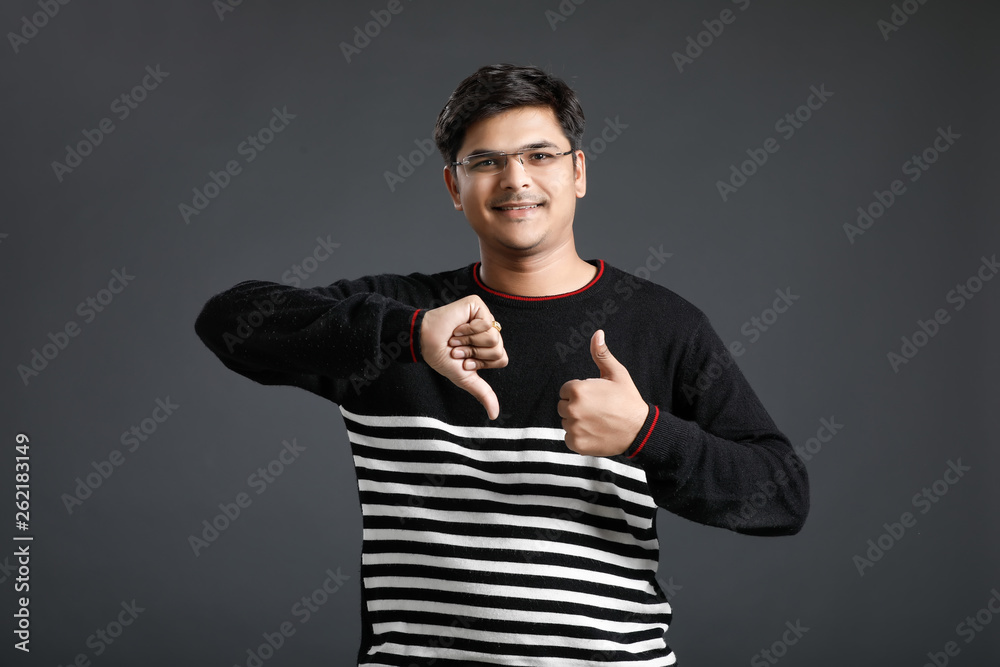 Young indian man showing thump up Young indian man showing thump up