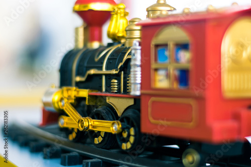 Toy plastic locomotive. Toy railway with train