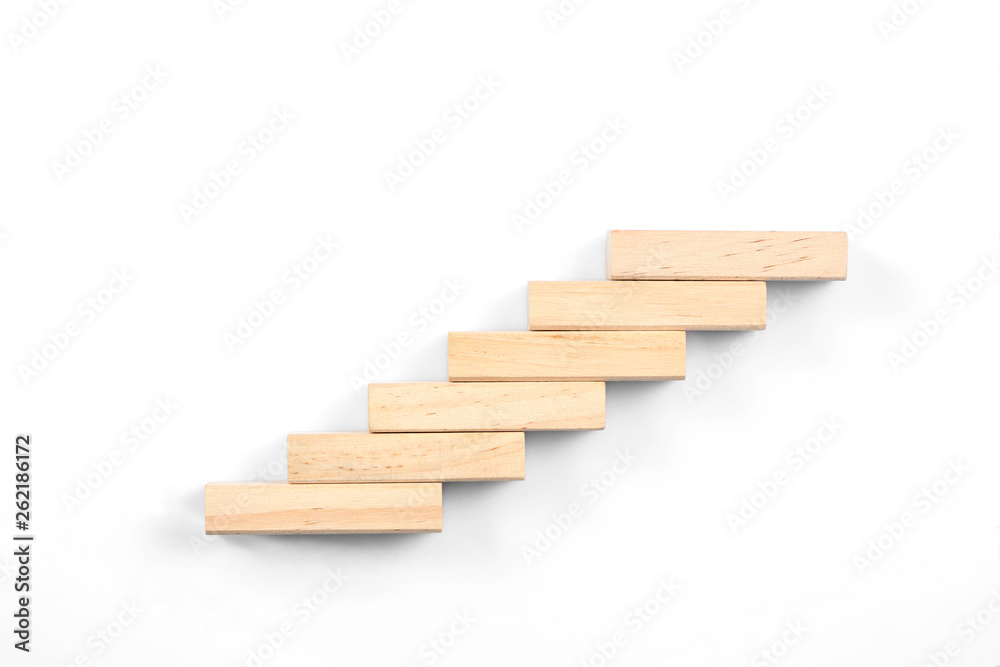 stairs concept; toy wood blocks make a stairs isolated on white background with copy space for your text stairs concept; toy wood blocks make a stairs isolated on white background with copy space for your text