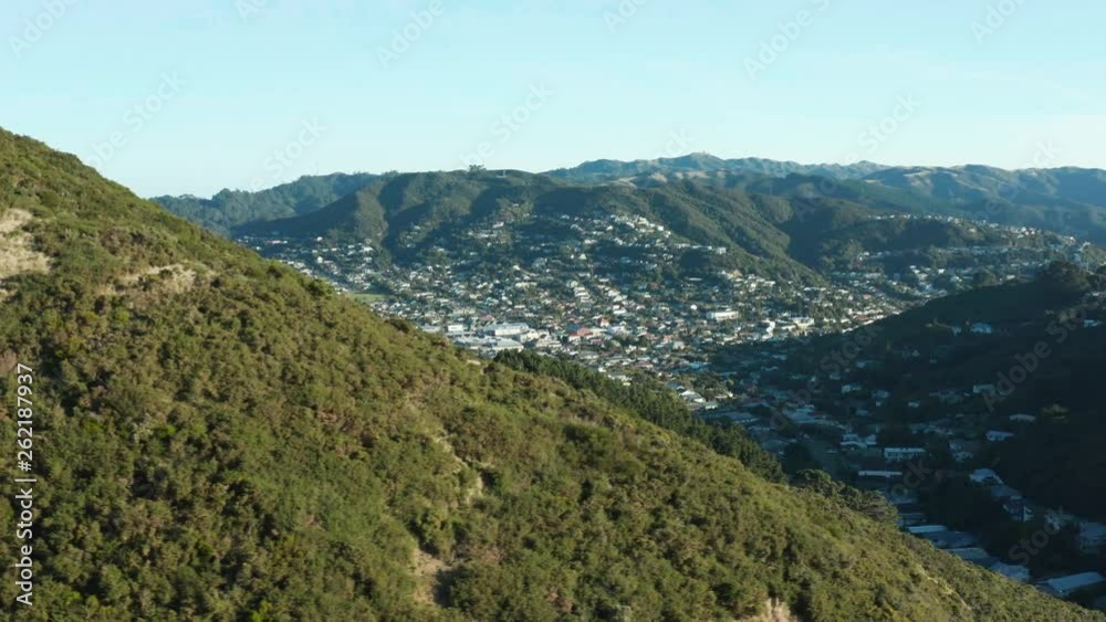 Aerial pan around Wellington Skyline Hike revealing Karori Suburb at sunset Aerial pan around Wellington Skyline Hike revealing Karori Suburb at sunset