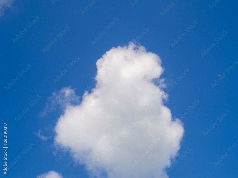 Beautiful, cumulus clouds in the blue sky