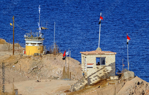 Guard posts on the border between Israel and Egypt seen from Taba resort town photo