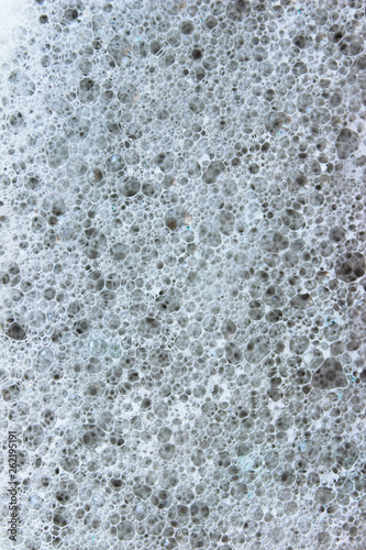 Abstract background of soap bubbles. Small bubbles. Micro photography, beautiful patterns. Amazing texture. Space
