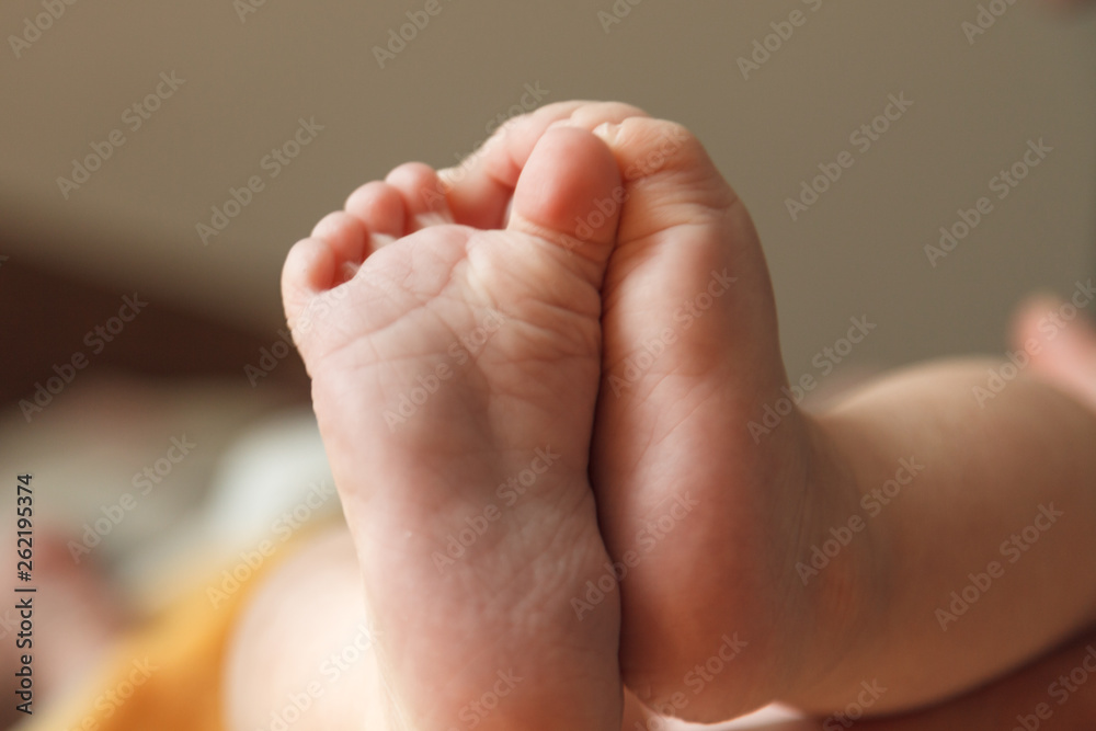 Closeup photo of a tiny baby feet Closeup photo of a tiny baby feet