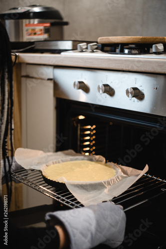 process of making and baking cake in oven at the modern kitchen