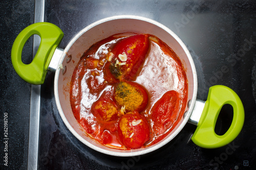 Appetizing tomatoes sauce preparation photo