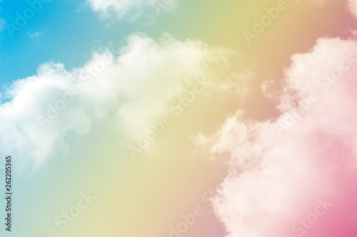 A soft fog cloud background whith a pastel colored orenge to blue gradient © Theeranad