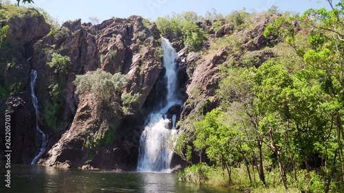 Drone reveal through trees of Twin Falls waterfall on South Alligator River in Kakadu National Park, Australia. photo