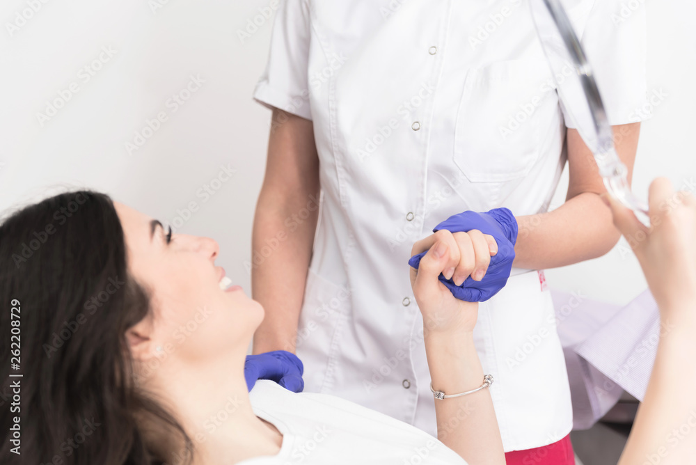 Fototapeta premium Satisfied female patient at doctor's office