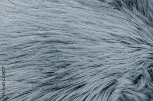 Long and thick gray fur. Grey artificial fur texture