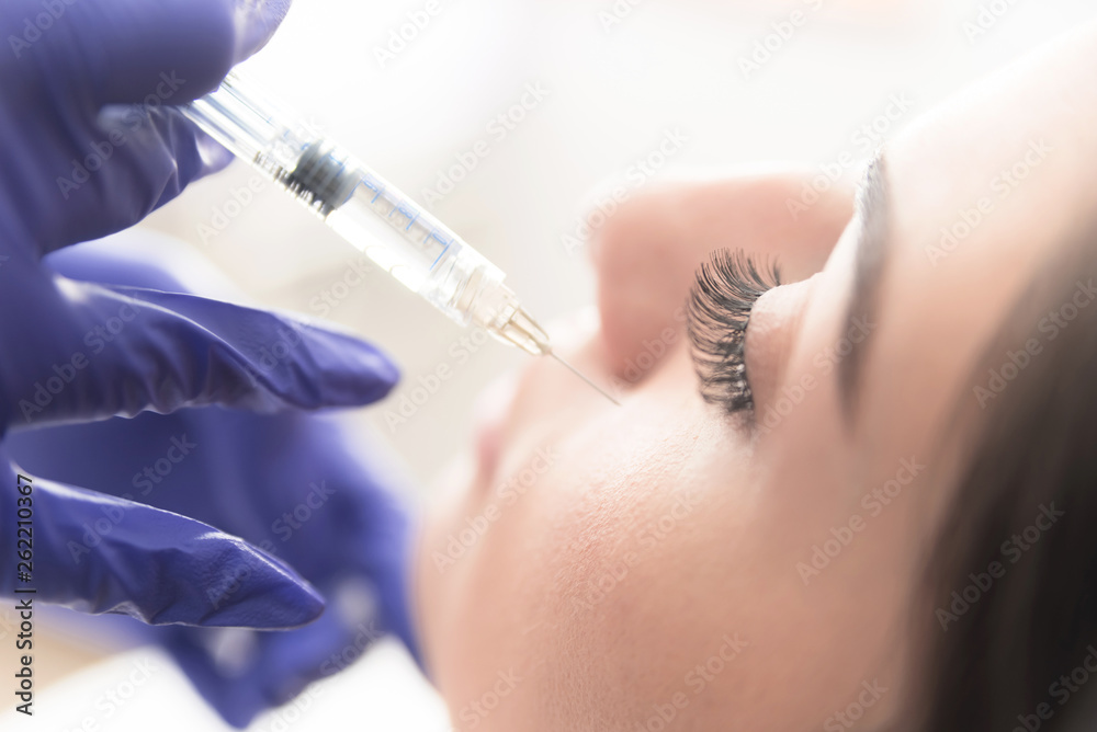 Injection of medical substance in patient face Injection of medical substance in patient face