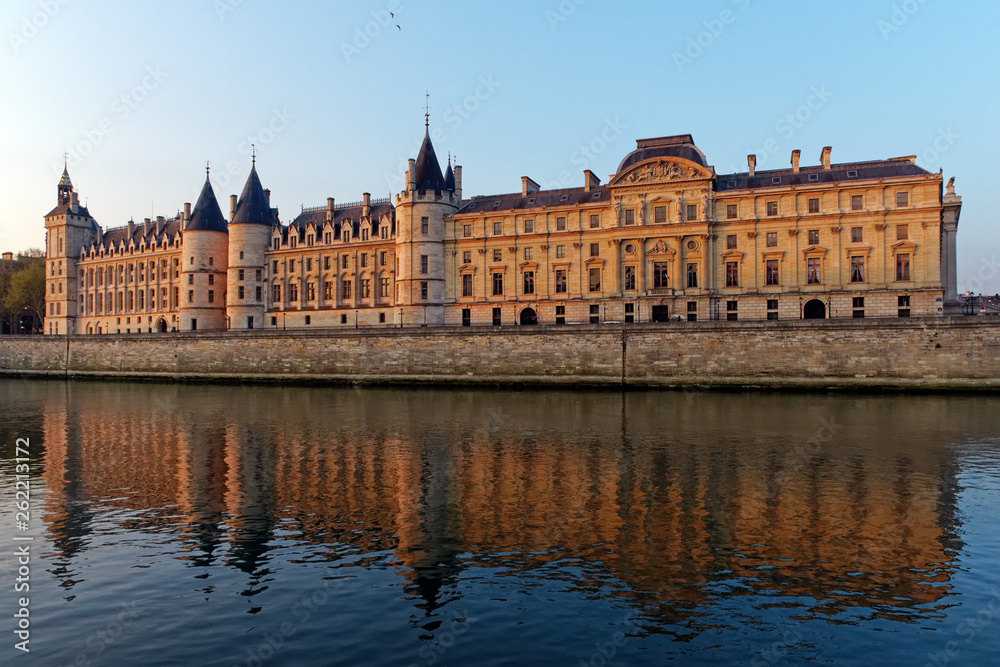 Conciergerie building on Seine river quay in Paris