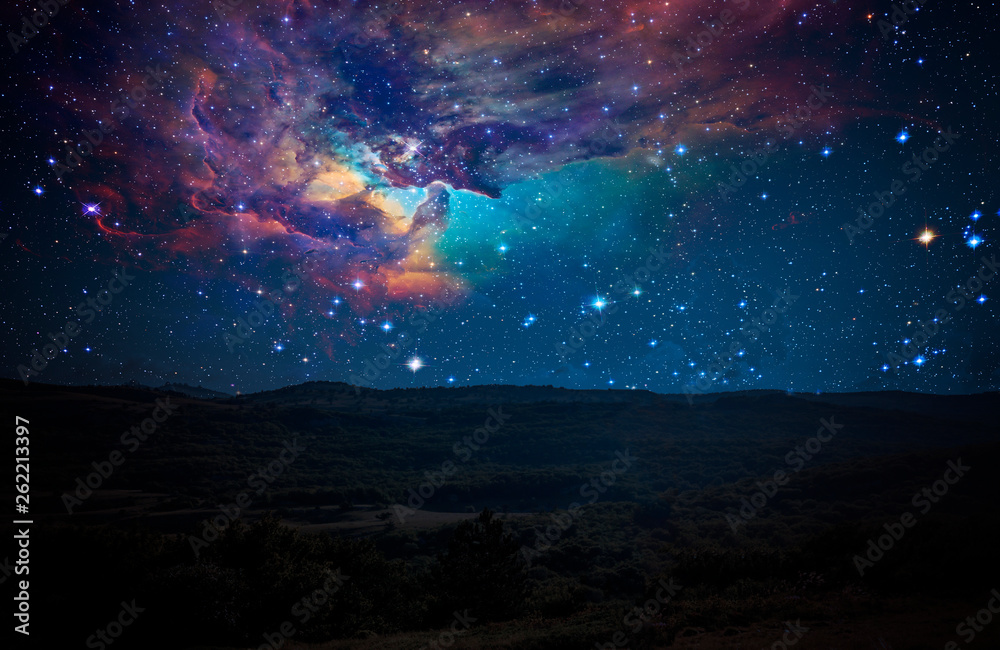 Fototapeta premium nature landscape and constellation over it, elements of this image furnished by nasa b