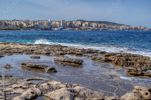 The rocky shore of Bugibba resort