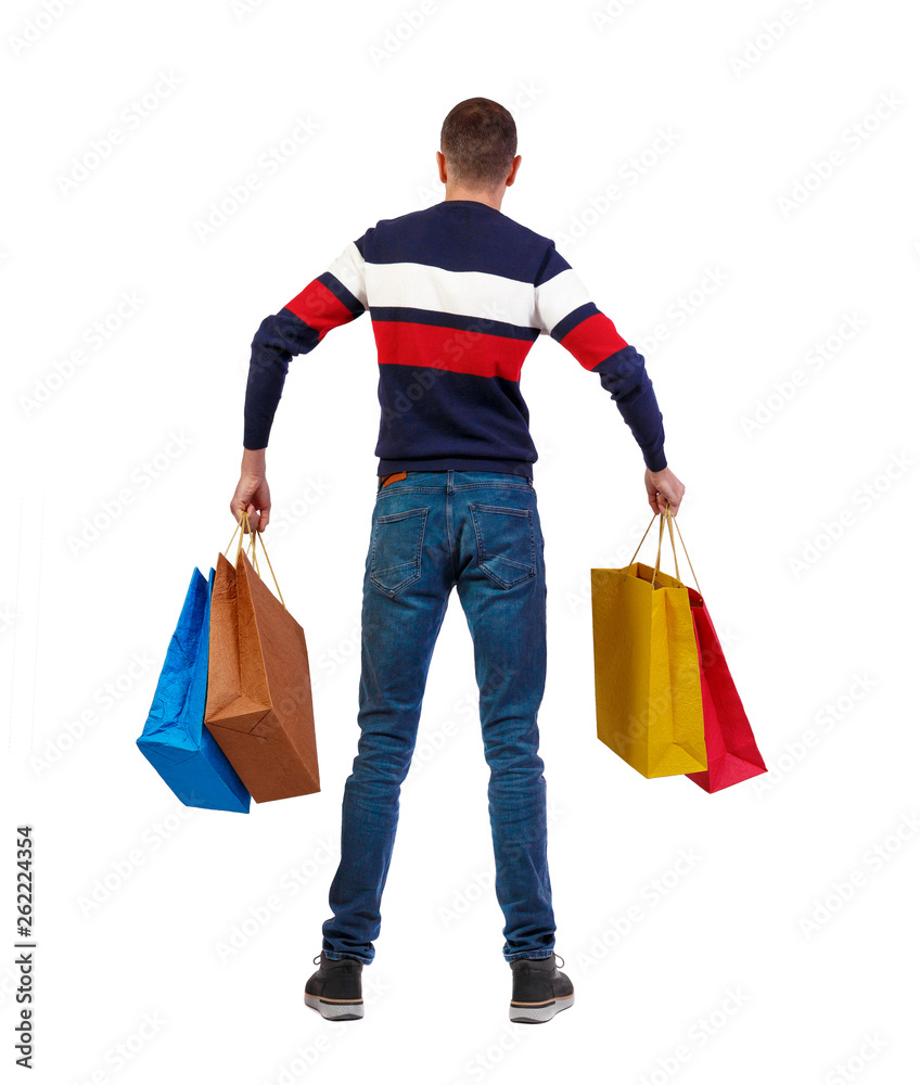 back view of man  with shopping bags .