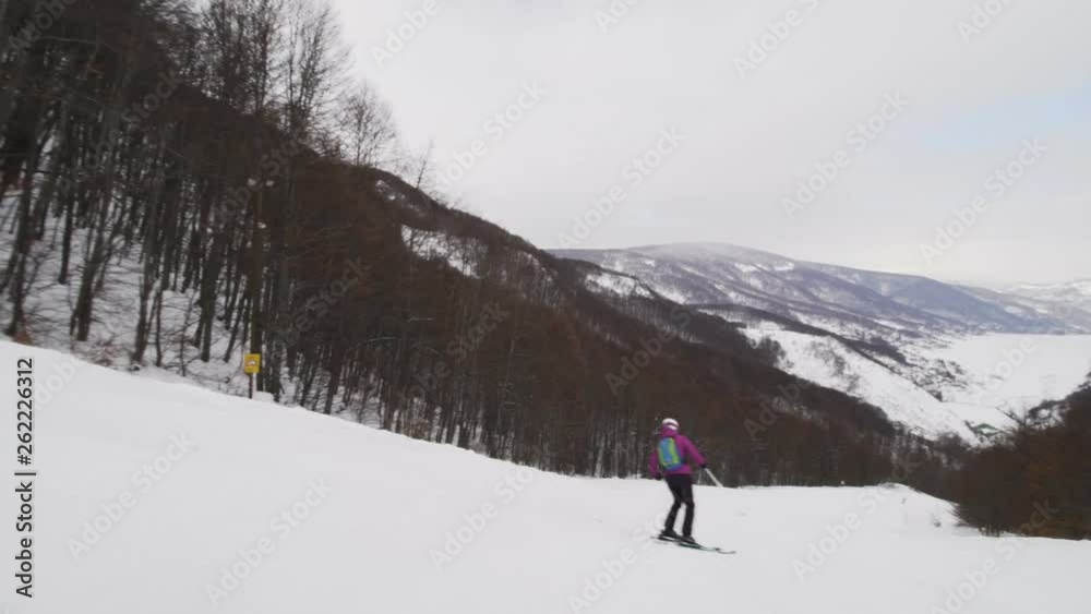 girl skiing on slopes in ski center Mavrovo in Macedonia girl skiing on slopes in ski center Mavrovo in Macedonia