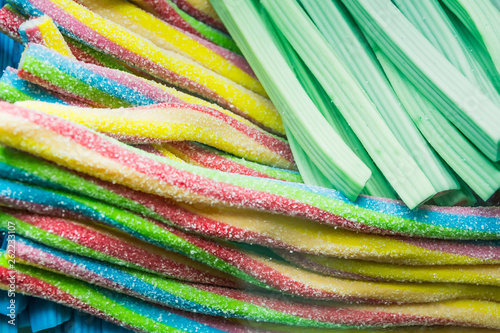 Background of multi-colored assorted jelly beans, chewing candies close-up.
