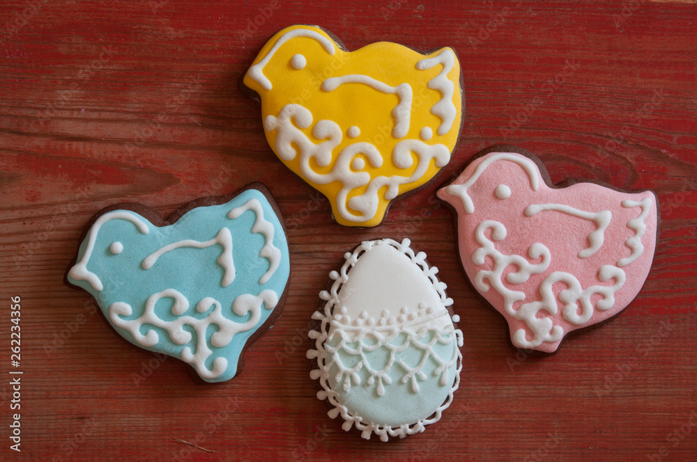 Colorful easter cookies on a wooden background