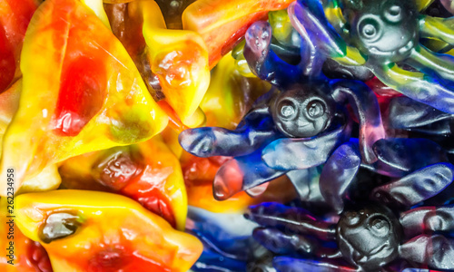 Background of multi-colored assorted jelly beans, chewing candies close-up.
