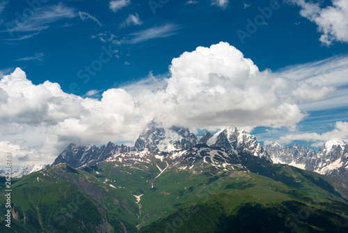 Mestia, Georgia - Jun 22 2018: Mount Ushba (4710m) view from Peak of Zuruldi Mountain. a famous landscape in Mestia, Samegrelo-Zemo Svaneti, Georgia. photo
