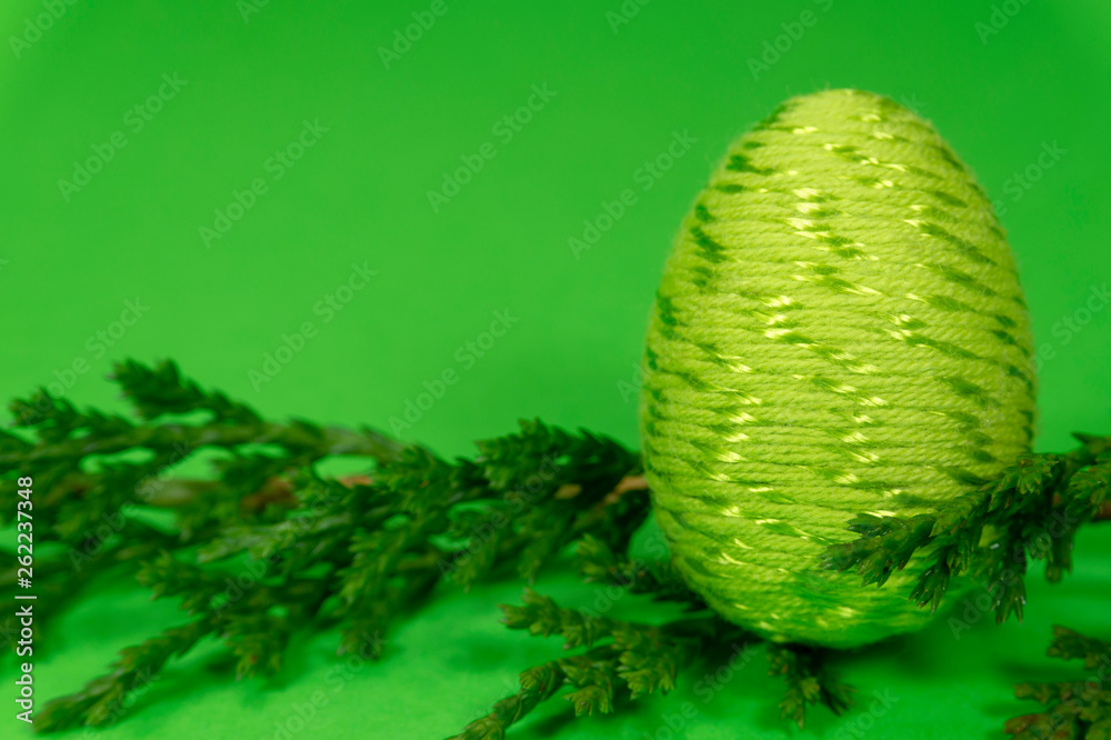 Fototapeta premium Happy Easter symbol egg on green background