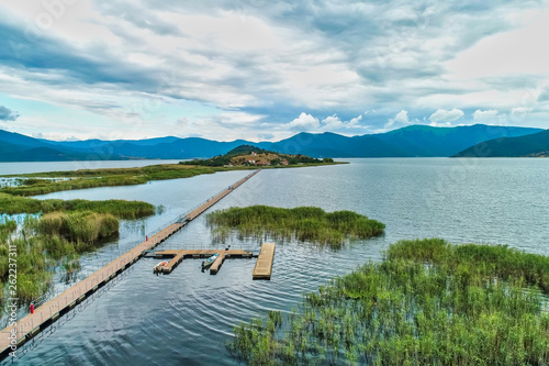aerial view of island of Agios Achilios in lake Small Prespes, Greece photo