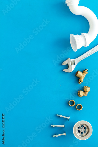 Plumber work with instruments, tools and gear on blue background top view mockup