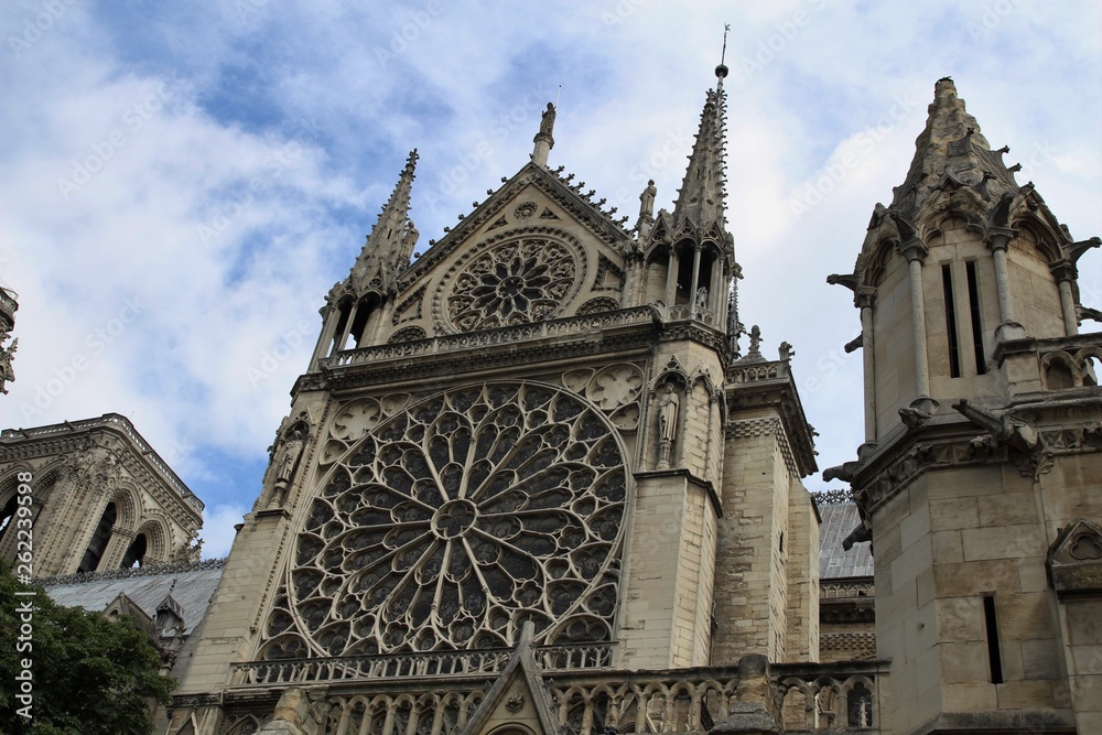 The roof of the iconic Notre Dame Cathedral. Notre Dame Cathedral in Paris, the symbol of the beauty and history. Construction began in 1163 and was completed in 1345.Sunny summer day in France City. 