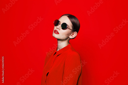 fashion model in sunglasses, beautiful young woman. photo