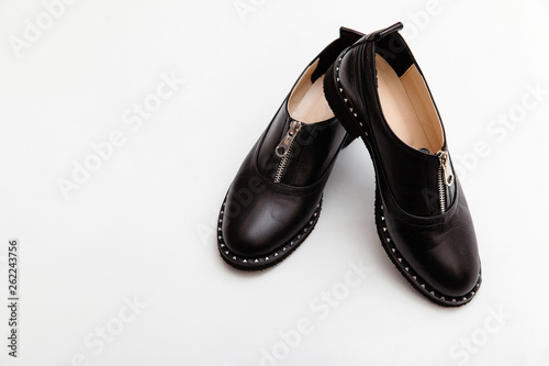 Stylish female spring or autumn shoes in black color. Beauty and fashion concept. Flat lay, top view 